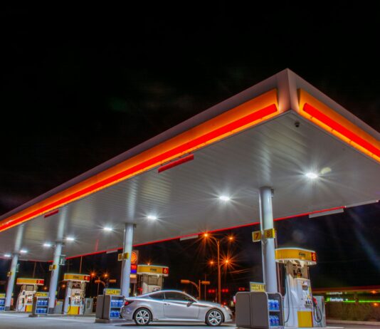 7월부터 유류세 인하율 조정…“석유류 가격 인상 자제해주길” white car parked in front of red and white building during night time