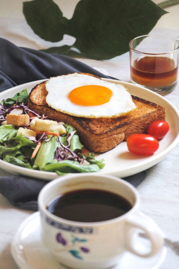 Photo by montatip lilitsanong burger with egg and lettuce on white ceramic plate