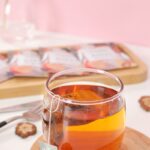 작지만 확실한 변화, 한국에 스며든 ‘웰니스’ 문화…일상 속 실천법 제안 clear drinking glass with orange liquid