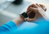 디지털 헬스케어의 진화, 스마트폰 하나로 건강 챙기기! person clicking Apple Watch smartwatch